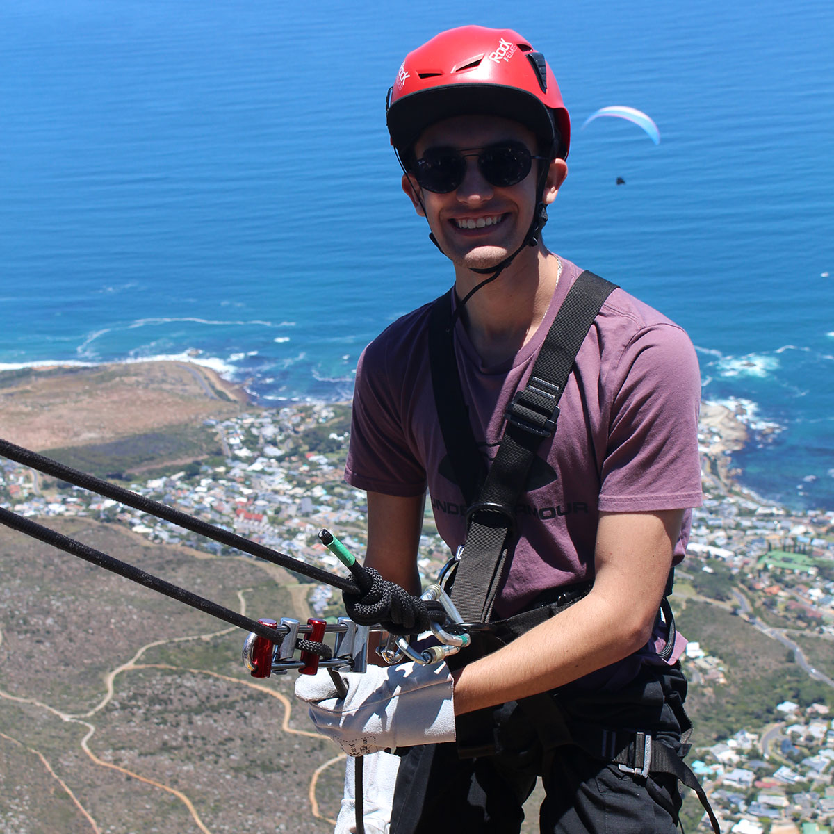 A Man abseiling down table mountain.